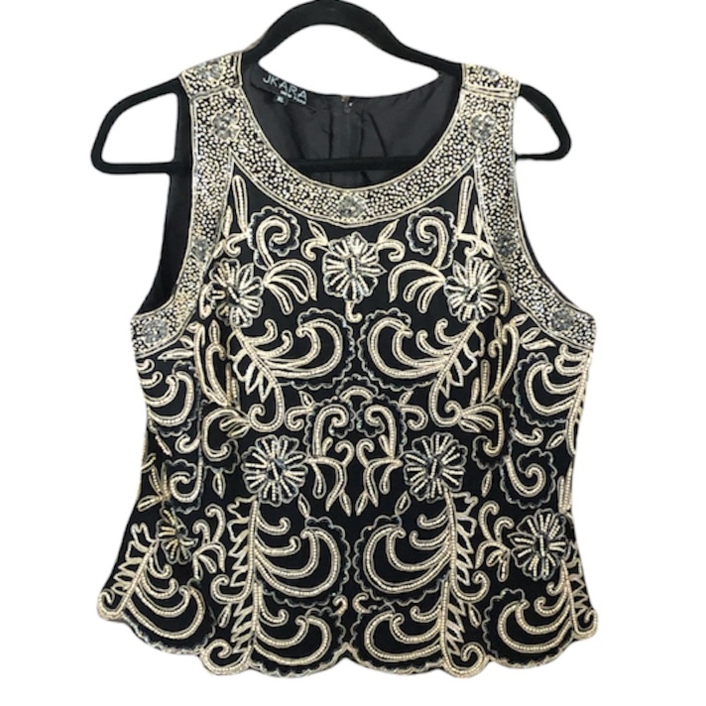 JKARA New York Elegant sleeveless blouse size xl but fits like a large.